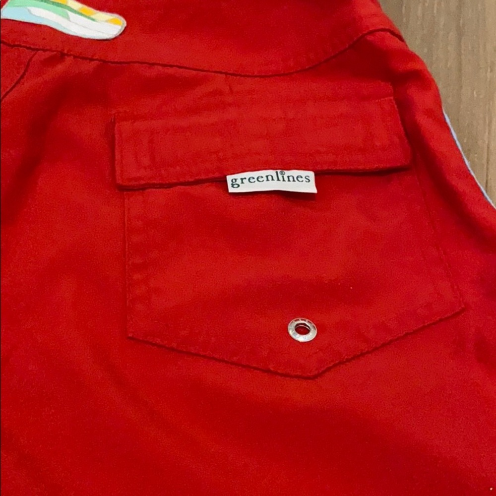 Red swim trunks with blue lining and pocket detail - Picture 3 of 4
